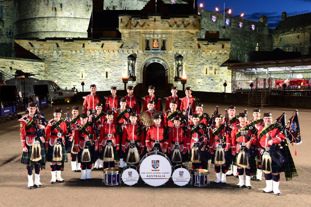 TOUR TRIUMPH: The Scots School Albury Pipe Band during the 2017 British excursion that included 25 performances watched by millions live and on television worldwide.