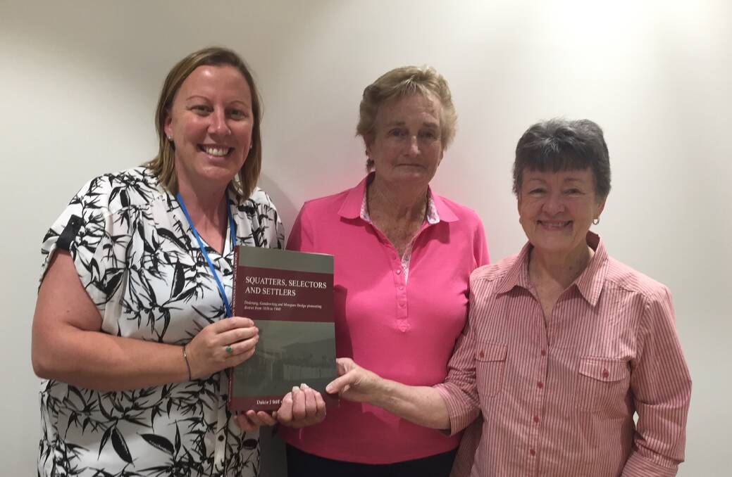 BOOK REPORT: Albury Wodonga Regional Cancer Centre Trust manager Kristy McMahon meets with history book authors Mary Cardwell and Dulcie Stiff