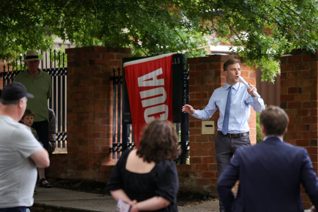 Jack Stean, of Stean Nicholls Real Estate, looks for bidders during the auction of 682 Jones Street, Albury, on Saturday, November 25. Picture by James Wiltshire