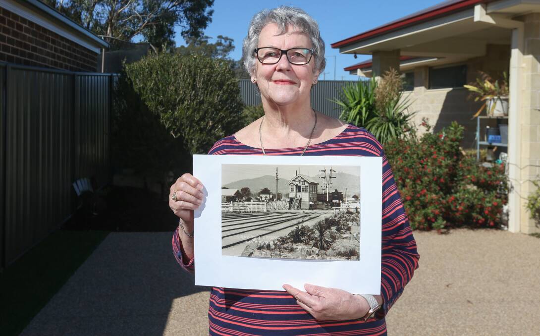 TOWN MEMORIES: Wodonga Historical Society secretary/treasurer Uta Wiltshire with one of the archive images that became an online jigsaw puzzle. Former Wodonga businesses and homes are also featured. Picture: TARA TREWHELLA