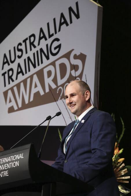 HUMBLE HERO: Corryong resident Michael Edwards, a TAFE NSW Wagga student and Snowy Hydro apprentice electrician, accepts his award for Apprentice of the Year. 