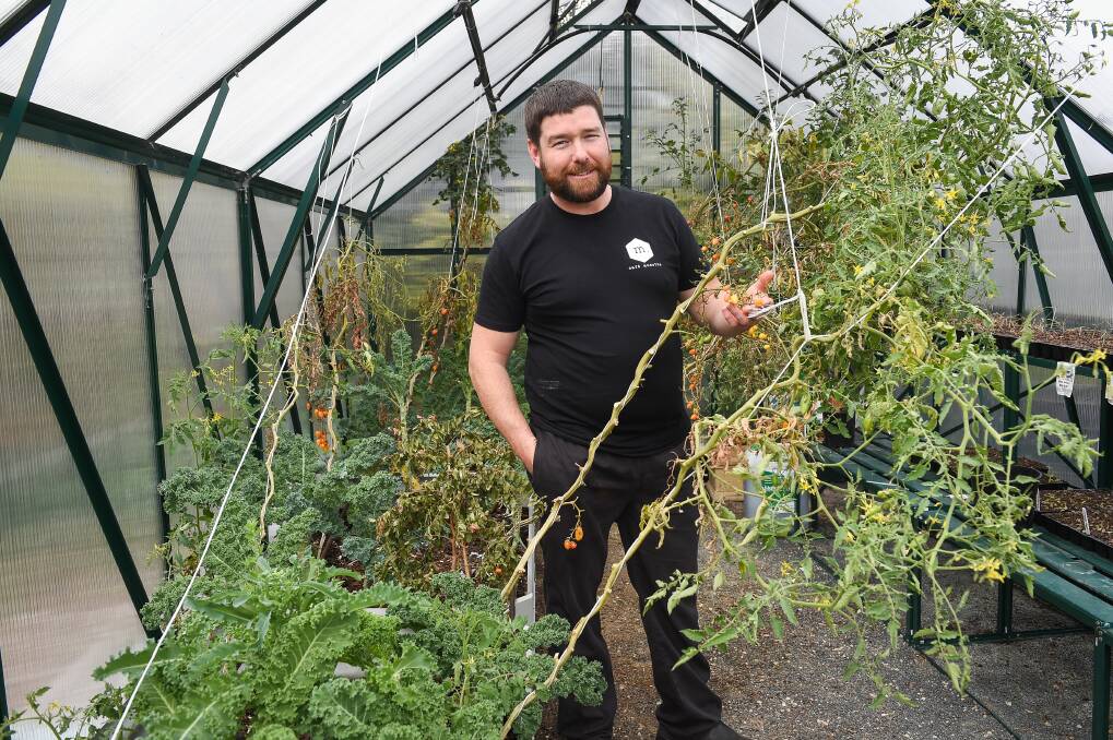 PLANS SPROUT: Cafe Musette chef Craig Scolyer appreciates the urban garden on site at the central Albury eatery. "The focus for the menu here is taking all these garden elements that we have," he says. Picture: MARK JESSER