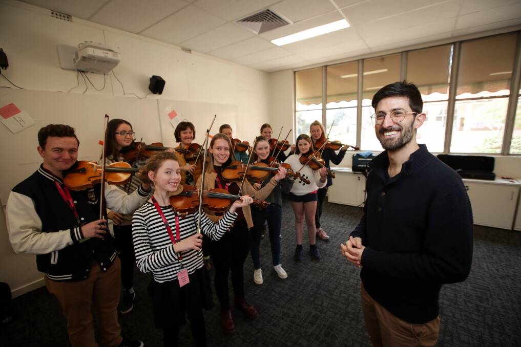 READY TO REHEARSE: Composer Andrew Aronowicz prepares to guide some string players at Border Music Camp on Monday. Picture: JAMES WILTSHIRE