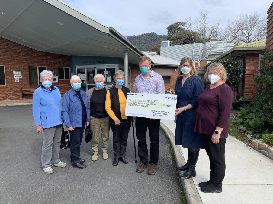 BIG DONATION: Mount Beauty Hospital Op Shop volunteers Margaret Ranten, Lynda Barter, Jan Driver and Margaret Mills present their contribution to Dr Jeffrey Robinson (Mount Beauty Medical Centre), health services
manager Leanne Kilpatrick and acting nurse unit manager Kerri Hore. 