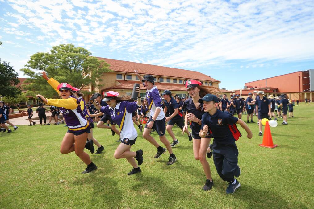 OFF THEY GO: Led by the year 10s, students at The Scots School Albury start their mini-relay on Tuesday. Picture: JAMES WILTSHIRE