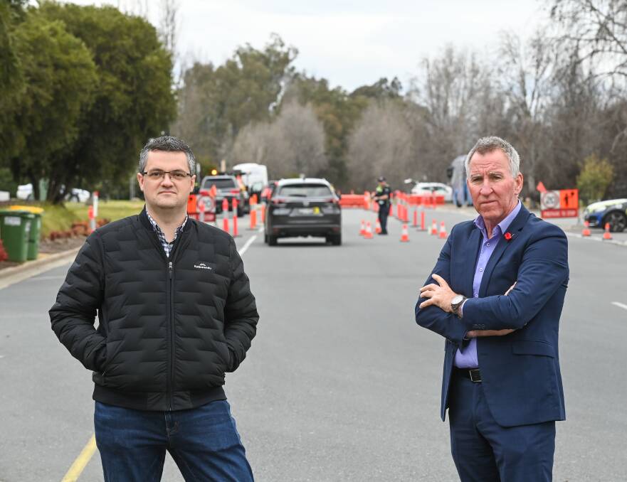 MORE PERMITS: Wodonga mayor Kev Poulton and his Albury counterpart Kevin Mack. "It's another one of those layers of being a border resident, it's frustrating for us all, but you can see ... their concern," Cr Poulton says.