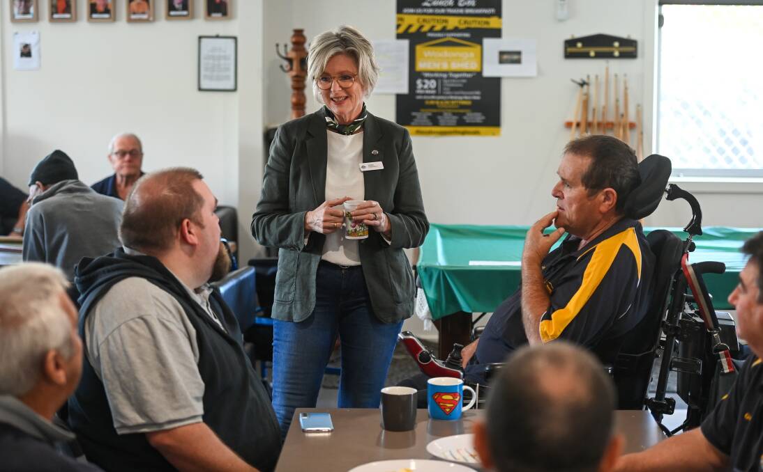 COMMUNITY ADVOCATE: Indi MP Helen Haines talks to Steve Willis and his father Jeff at Wodonga Men's Shed. Picture: MARK JESSER