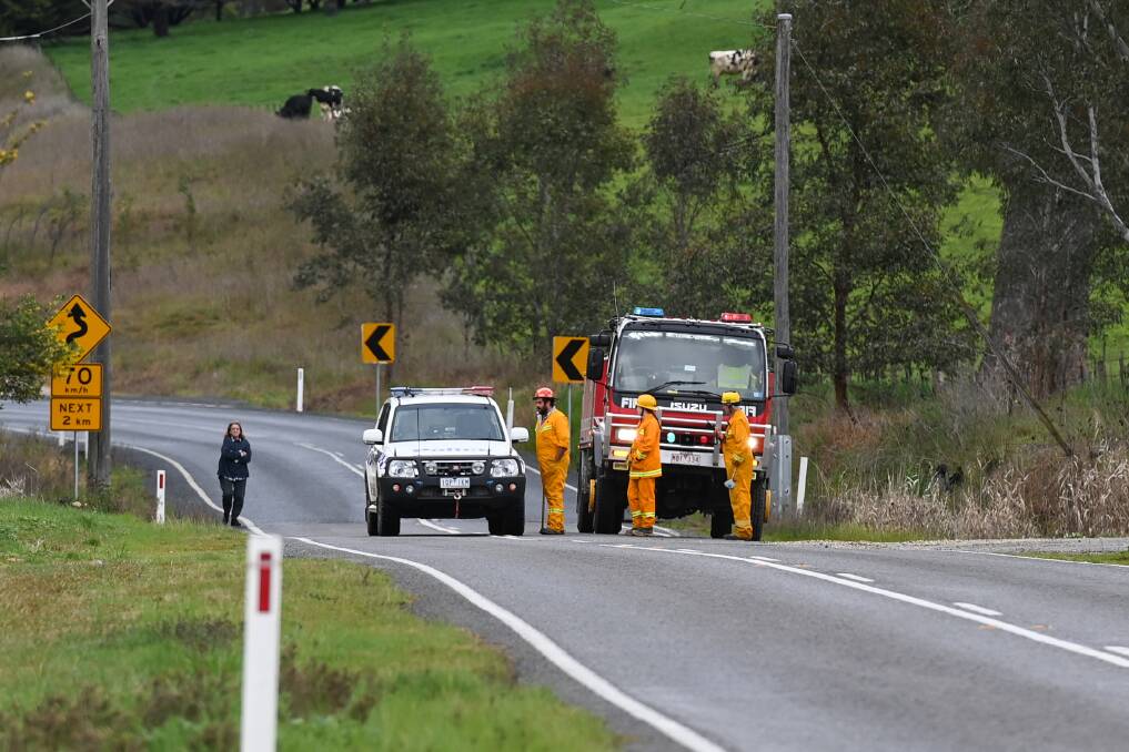 TRAFFIC AFFECTED: Emergency personnel block off the Kiewa Valley Highway on Tuesday morning. Picture: MARK JESSER