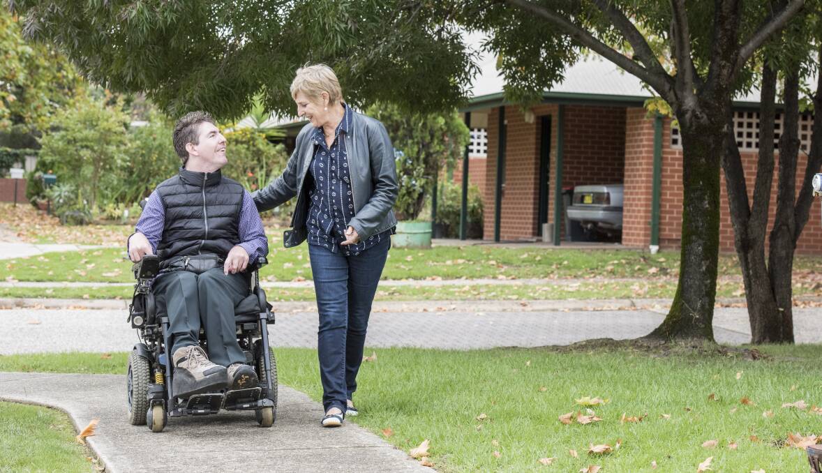 WAIT AND SEE: Albury's Curt Gouma and his mother Jan think a lot of people are "a little bit cynical, but also hopeful" about the NDIS, which becomes available in the Murrumbidgee region on Saturday.