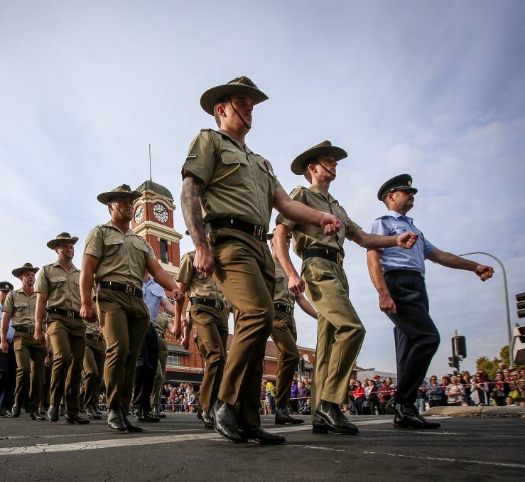 STEP OUT: Australian Defence Force personnel, veterans, emergency service workers and groups of school children join the annual march through Albury's centre, which was led by 14 horse riders, including nine pony club members. Picture: JAMES WILTSHIRE