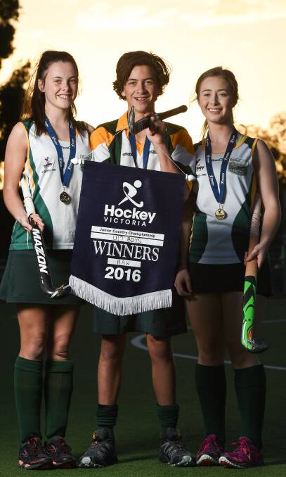MULTIPLE WINS: Hockey Albury-Wodonga players Brittany Rosewarne, 16, Hudson Erskine, 16, and Imogen Albon, 17, with the spoils of victory. Picture: MARK JESSER