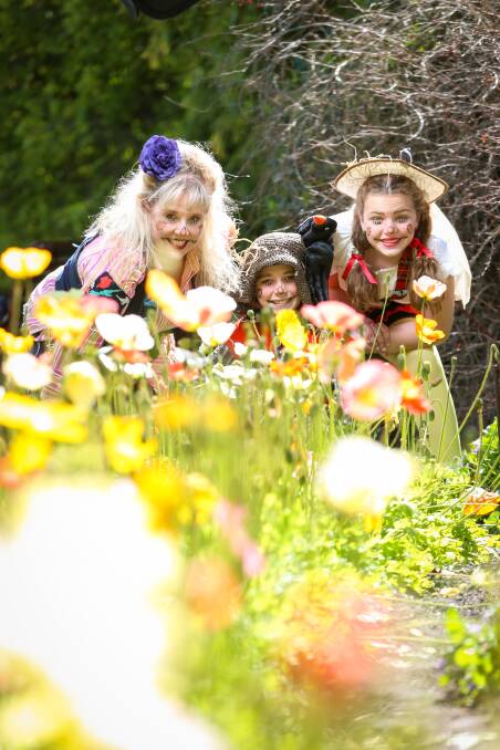 FLOWER POWER: The scarecrow family Natasha Quinn, Connor Skillicorn, 11, and Ebony Banks, 12, launch Albury Council's Gardenesque. Picture: JAMES WILTSHIRE