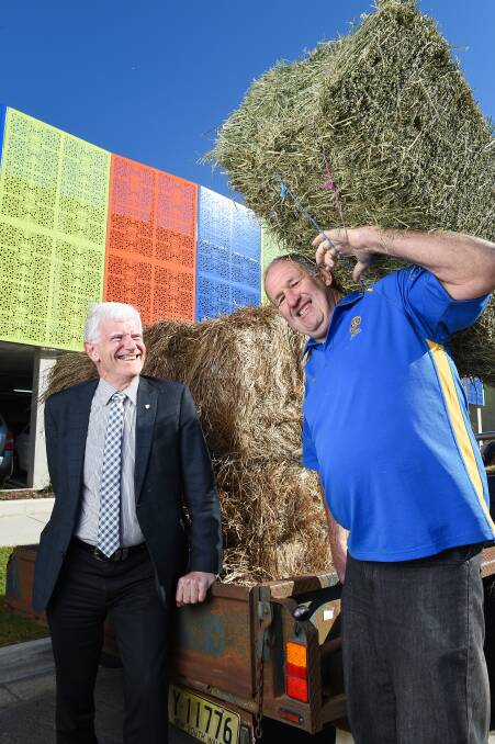 SUPPORTING FARMERS: Rotary club presidents Rob Simmons (Albury North) and Doug Gammon (Belvoir-Wodonga) get behind the campaign. Pictures: MARK JESSER