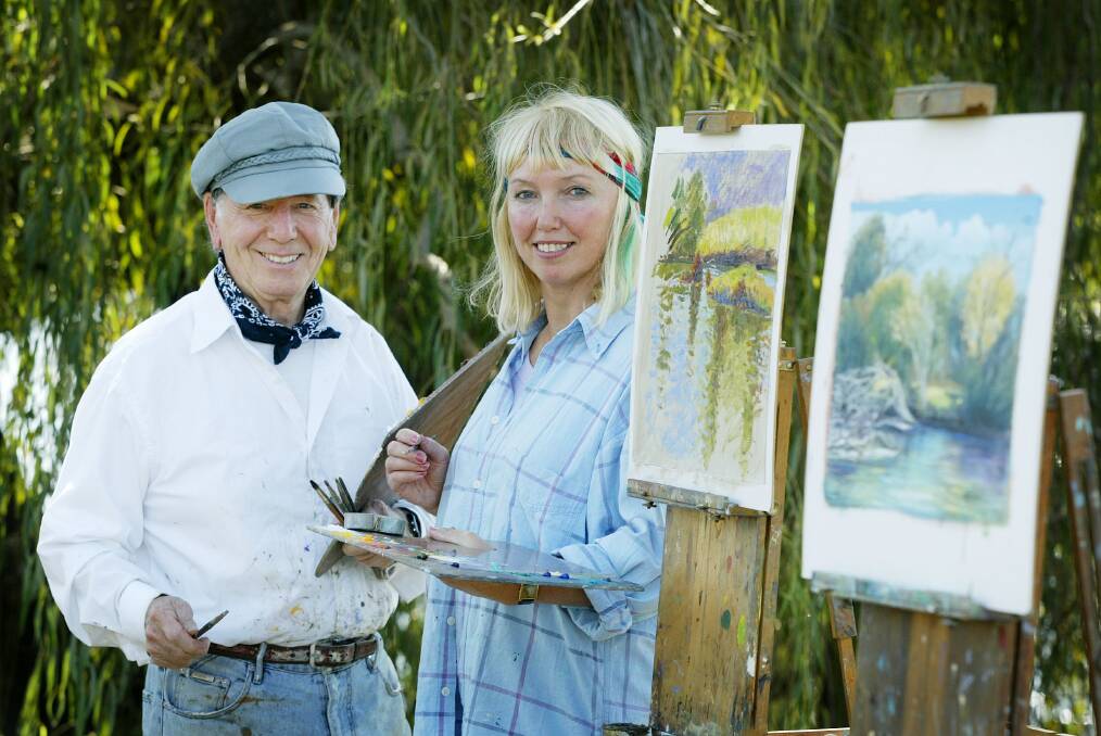 IN THE FIELD: Seidel and fellow Border artist Stephanie Jakovac take a break from their painting beside the Murray River near Albury in April 2005.