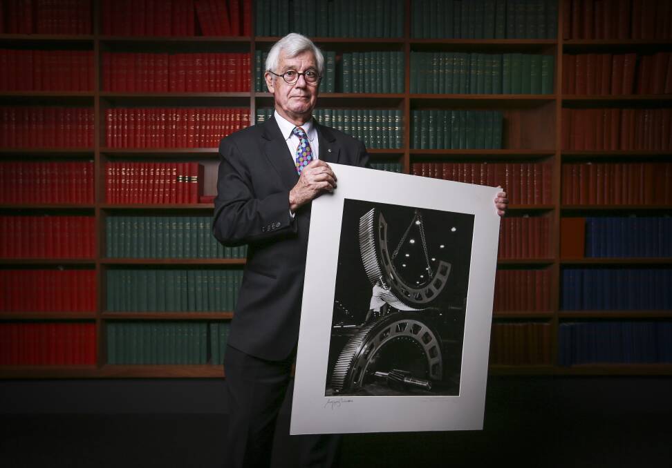 SPECIAL GUEST: Well-known human rights and refugee advocate Julian Burnside holds a rare print ahead of a charity auction last year. The barrister will attend the Rural Australians for Refugees national conference in Albury-Wodonga.