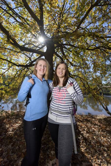 WALKING TALL: Jess Wallis-Hinde and Sophie McKeon form half of the JAMS team that  will tackle 30 kilometres of peninsula coastline for charity. Picture: SIMON BAYLISS