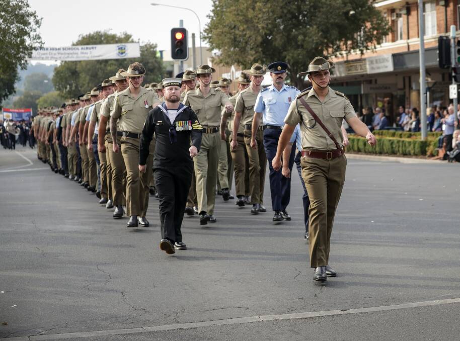 COMMEMORATIONS: The 2018 Albury Anzac Day march makes its way along Dean Street.