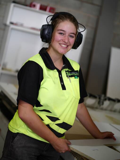 HANDS ON: Sharni Van Werkhoven, 17, of Jindera, enjoys learning on the job as an apprentice cabinet maker. She joined QA Kitchens after doing work experience there.