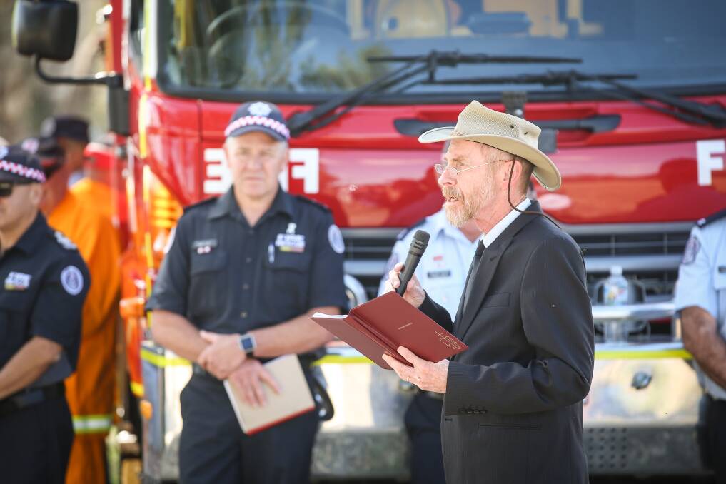 EMERGENCY SUPPORT: As CFA chaplain, David Poole leads the 75th anniversary commemoration of a 1943 Tarrawingee fire tragedy in December 2018.