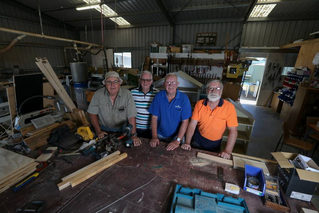 HERE'S HOW: Graham Molkentin, John Coughlan, Fred Jesshope and Jeff Hughes in the Howlong Men's Shed main space. Picture: TARA TREWHELLA