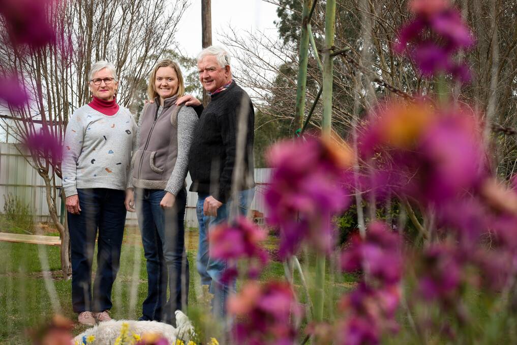 FAMILY SUPPORT: Ainslie Campbell and her parents Alison and Peter, in her Henty garden. Picture: JAMES WILTSHIRE