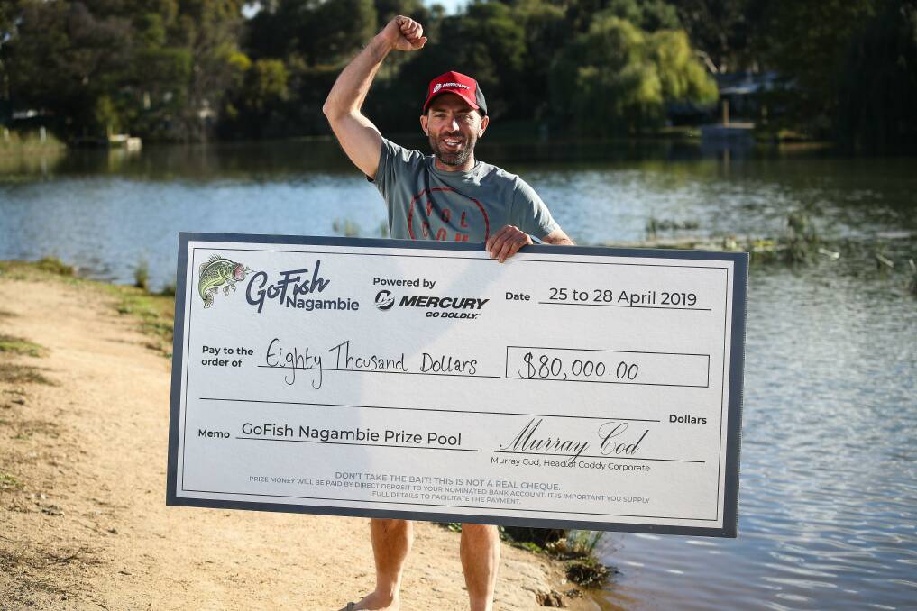 CELEBRATION: Albury's Clint Alvey claims his cash prize for the biggest Murray cod at GoFish Nagambie. Picture: CON CHRONIS