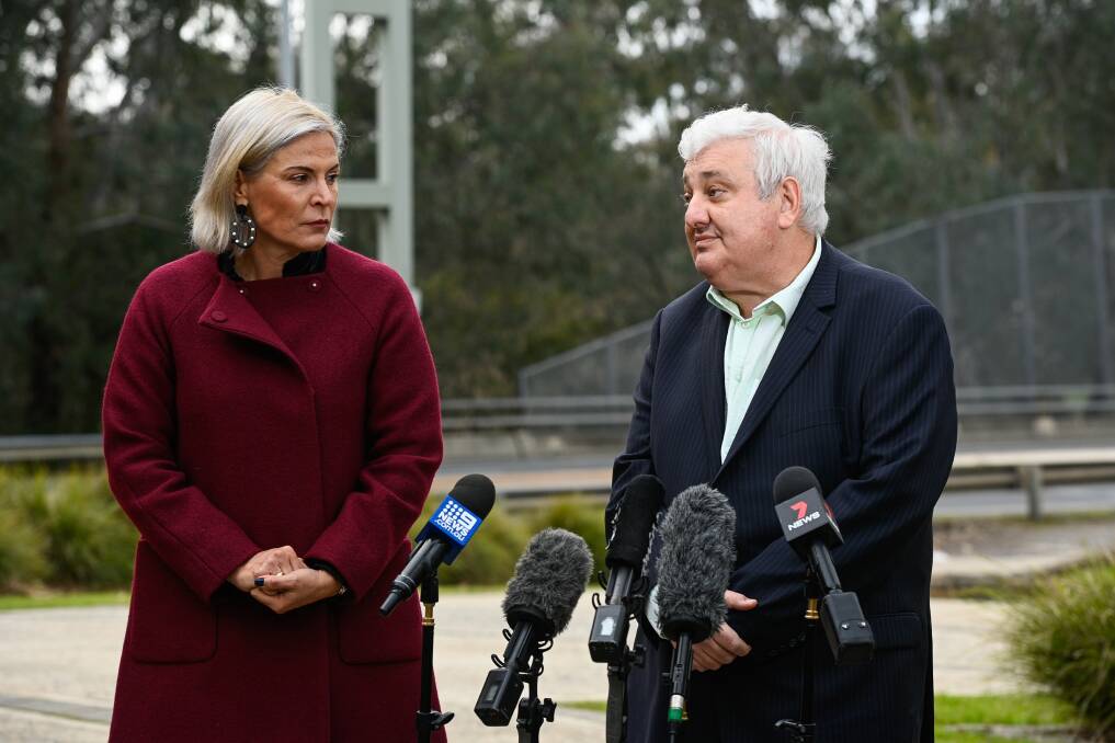 COMMUNITY IMPACT: Albury Wodonga Health chief executive Michael Kalimnios joins then-Wodonga mayor Anna Speedie on the Lincoln Causeway in early July to express their concerns about NSW shutting the border.