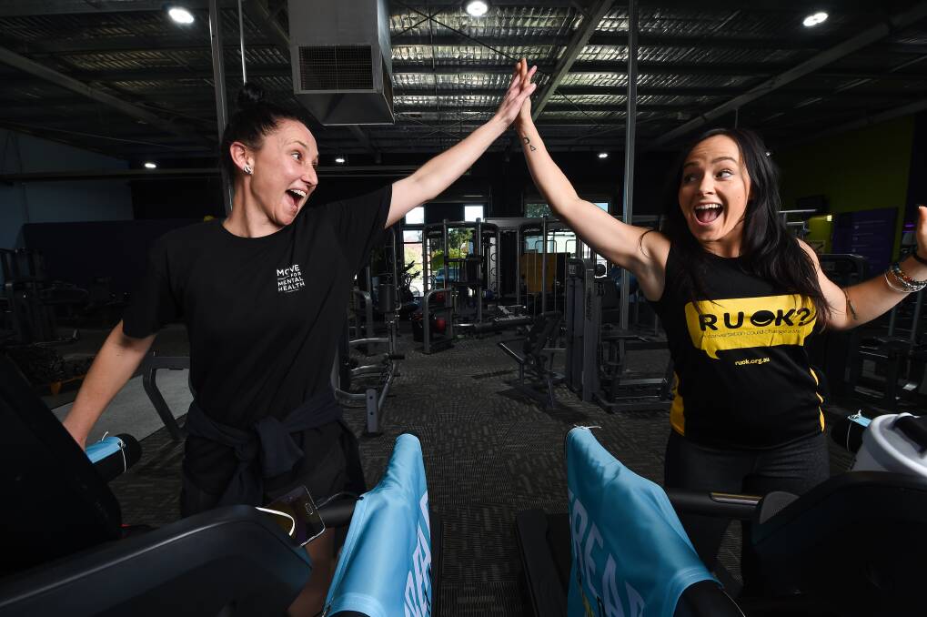 SMASHING IT: Anytime Fitness Wodonga staff members Abbey O'Brien and Chloe Hawkins can still smile during the treadmill challenge, despite limited sleep and multiple steps. Picture: MARK JESSER