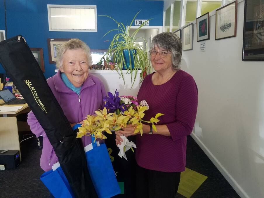 GETTING READY: Margaret and Diane Davis pick up their flag and host bags from the Corryong Neighbourhood Centre in preparation for the Upper Murray Garden Getabout.