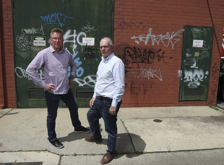 JOINT EFFORTS: Albury mayor Kevin Mack and Rotary Club of Albury Hume's Terry Simmonds say the cost of graffiti damage mounts up. Picture: ELENOR TEDENBORG