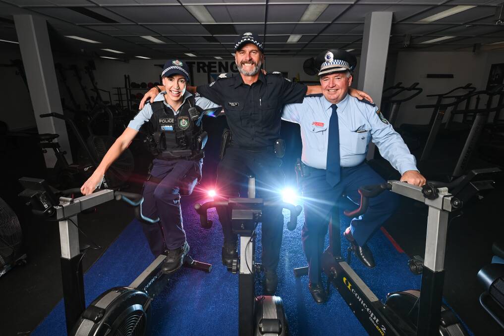 OFFICERS UNITED: Albury Acting Sergeant Tennille Doolan, Wodonga Sergeant Branko Ivic and Albury Chief Inspector Scott Russell all want to support the cancer centre - but there may be a bit of riding rivalry. Picture: MARK JESSER
