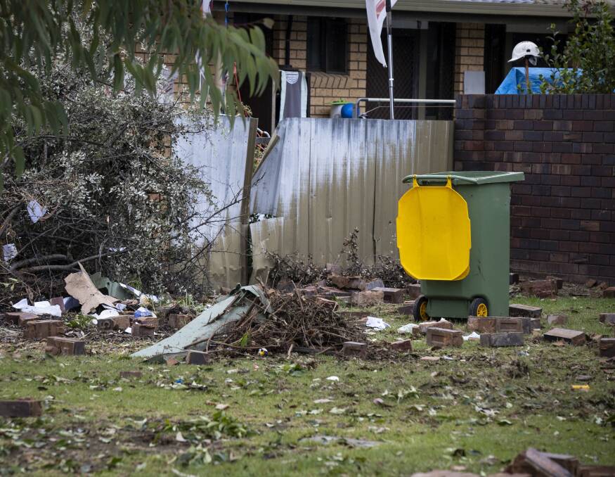 CLEAN-UP REQUIRED: The aftermath of Wednesday morning's incident, where a car left the road and smashed into a yard in Prune Street, Lavington. Picture: ASH SMITH