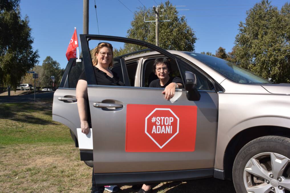 MAKING THEIR POINT: Bobbi McKibbin and Tracey Esler say the fossil fuels used by this vehicle is next to nothing compared to the potential damage of the Carmichael coal mine