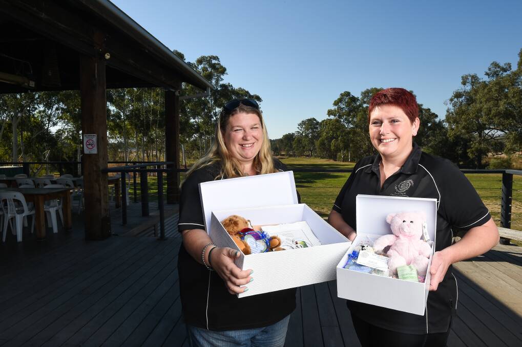 BRINGING COMFORT: Border Baby and Pregnancy Loss Support's Nell McLean and Sara Bayliss with boxes the group creates for grieving parents. Picture: MARK JESSER