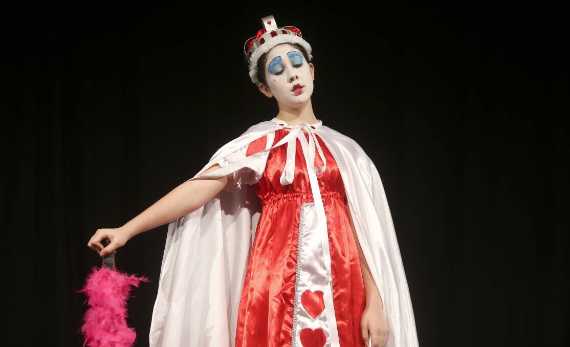 RIGHT ROYAL ENTERTAINMENT: The Red Queen from Alice In Wonderland, also known as Jaimee Gaston, is the character in costume section's opening performer.