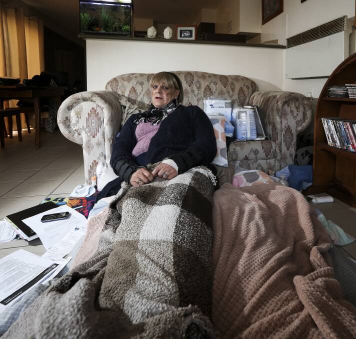 FEELING ABANDONED: Donna Macklan lies in her makeshift bed on the floor of her North Albury unit. "I'll sit here crying, I get so down," she says. Picture: JAMES WILTSHIRE