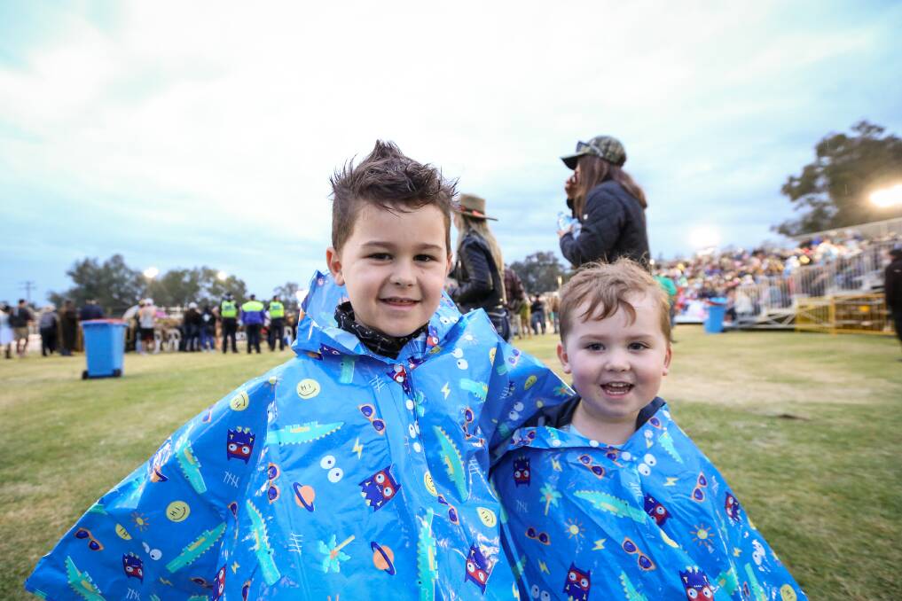 WELL PREPARED: Taj Warnett, 5, and his brother Ollie, 3, of Wodonga, are ready for possible wet weather at Gateway Lakes. Picture: JAMES WILTSHIRE