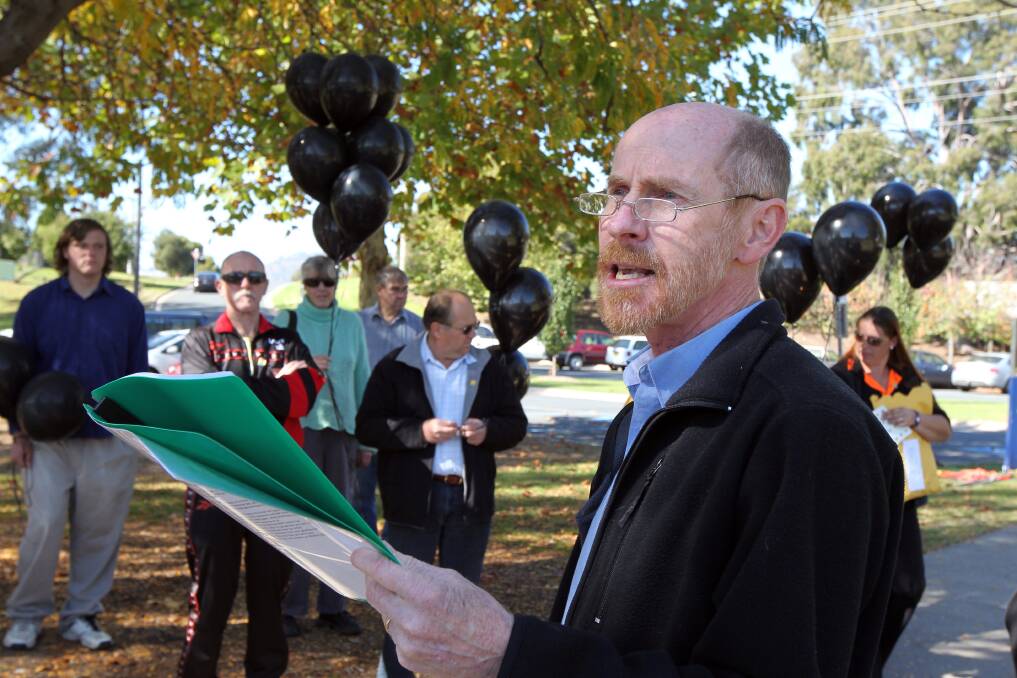 LONG SERVICE: David Poole talks to the crowd at Wodonga's Sumsion Gardens in 2012, at the unveiling of an Australian Workers' Memorial Day plaque.