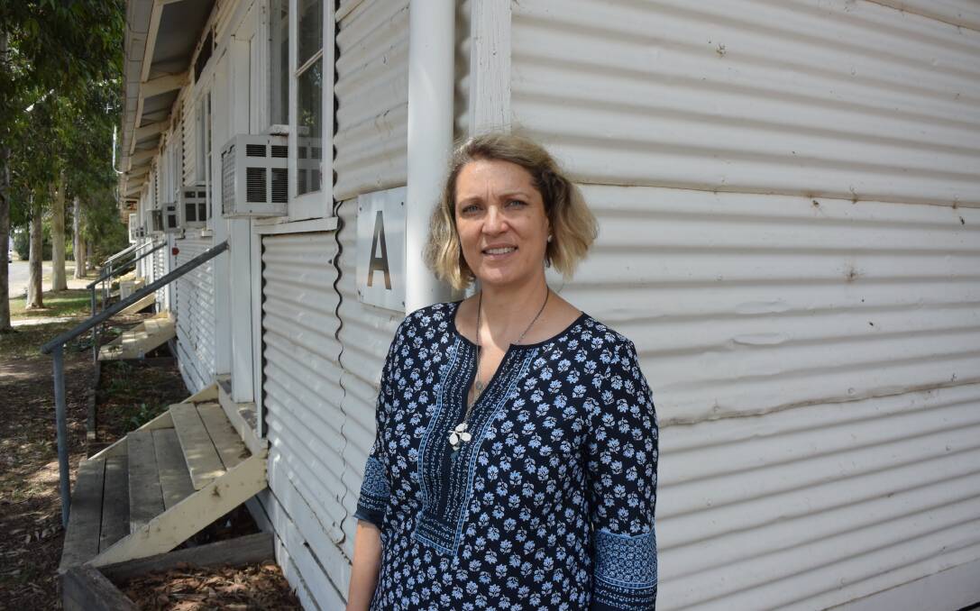 HISTORY OF NOTE: Benalla Migrant Camp chairwoman Sabine Smyth stands in front of a former hut, part of the site now given heritage listing.