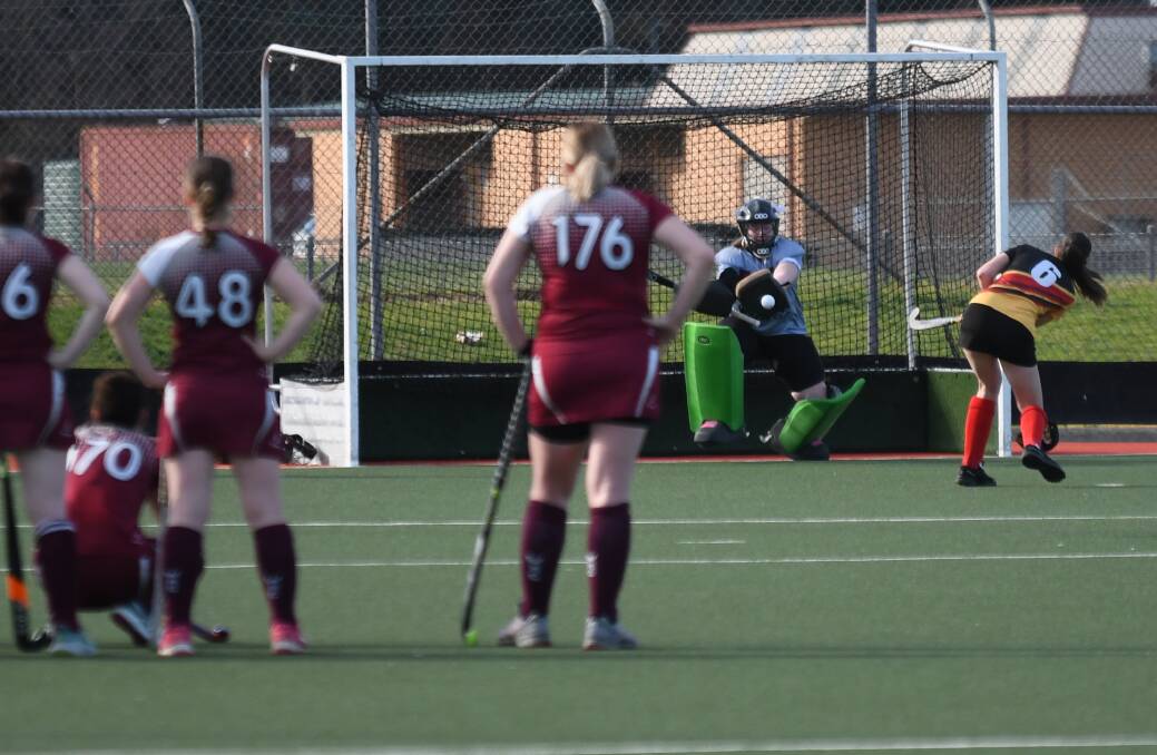 Wodonga's goalie saves a penalty flick from Bella Heagney of CR United. Picture supplied 