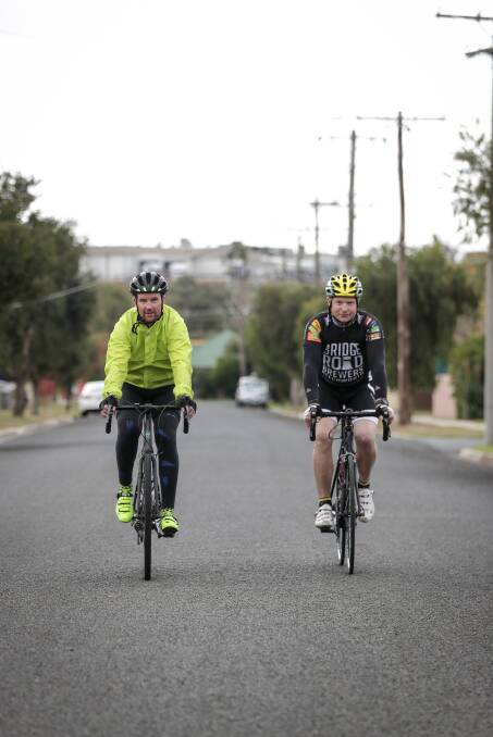 ON TRACK: The Coo-Wee Ride founder Matt Aldridge and Major Damien Batty cycle through Wodonga during their visit last year.