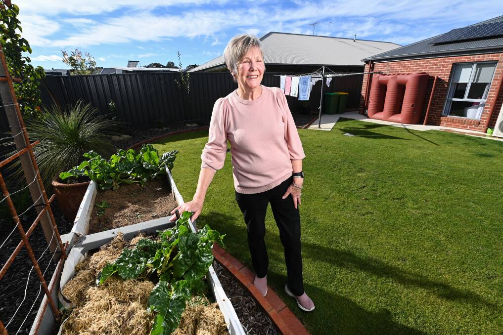 ADJUSTMENTS NEEDED: Moving into a purpose-built Thurgoona home with no steps has assisted Maralyn Allitt, seen here next to her higher raised garden. She tries to walk each day and remain active. "Once you don't use your muscles, they die quicker," she says. Picture: MARK JESSER