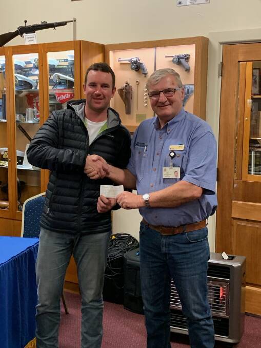 SHOWING SUPPORT: Coo-Wee Ride founder Matt Aldridge presents the cheque for $10,000 to Hume Veterans Information Centre welfare advocate Alex Wolf, accepting on behalf of centre chair Wayne Taylor.