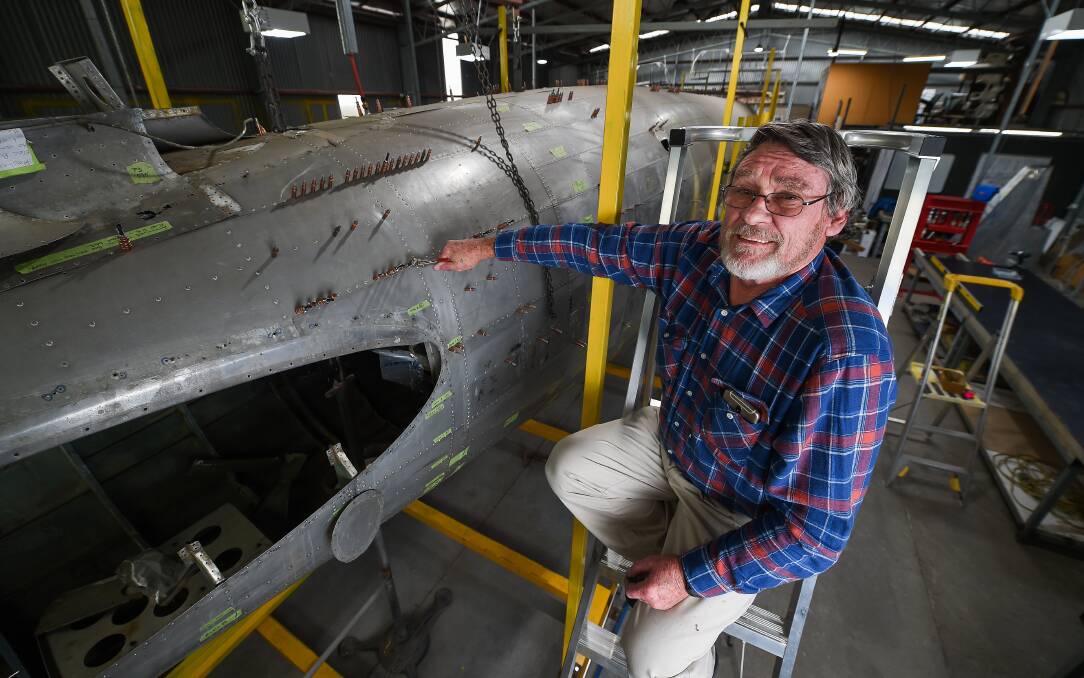 MUCH TO DO: Albury's Russ Jacob, who has a background as a fabricator, does his bit to help restore the Uiver DC-2 plane. Picture: MARK JESSER
