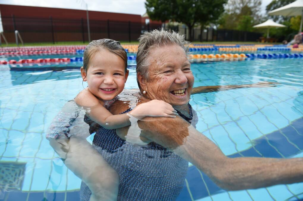 SWEET RELIEF: Wodonga's Sue Crutch gives granddaughter Maeve Dunsmore, 3, a ride as the pair enjoy cooling down at Albury Swim Centre on Friday. Picture: MARK JESSER