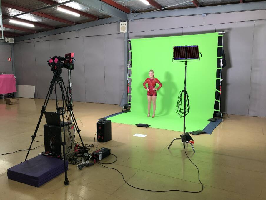VIRTUAL PERFORMANCE: Assisted by her father and with directors watching on Zoom, Abbey Copeland films her dance routines using a supplied kit of equipment.