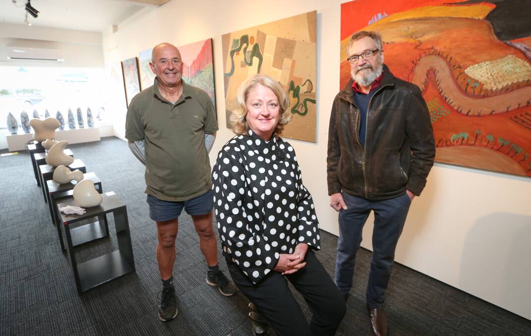 COMMON CAUSE: Fundraiser Harry Chisholm, Art Partners Australia founder Jacinta Mirams and artist Chris Ellis are all contributing to Parkinson's research in different ways. Ellis' exhibition ends this week. Picture: JAMES WILTSHIRE