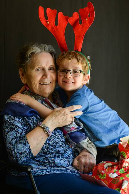 BIG HUGS: Mary Rains catches up with her great-grandson William Manning, 4 during the preschool visit. Picture: MARK JESSER