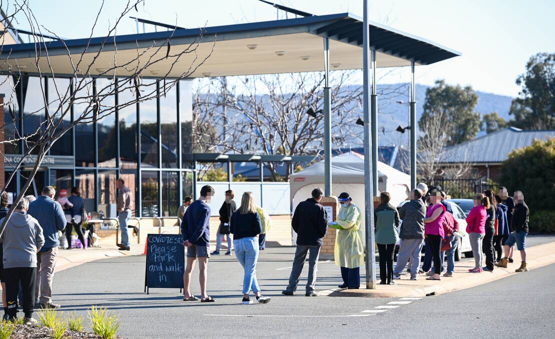 TESTING TIMES: People wait their turn at Murrumbidgee Local Health District's pop-up COVID-19 testing clinic at Mirambeena Community Centre, Lavington, earlier this month.
