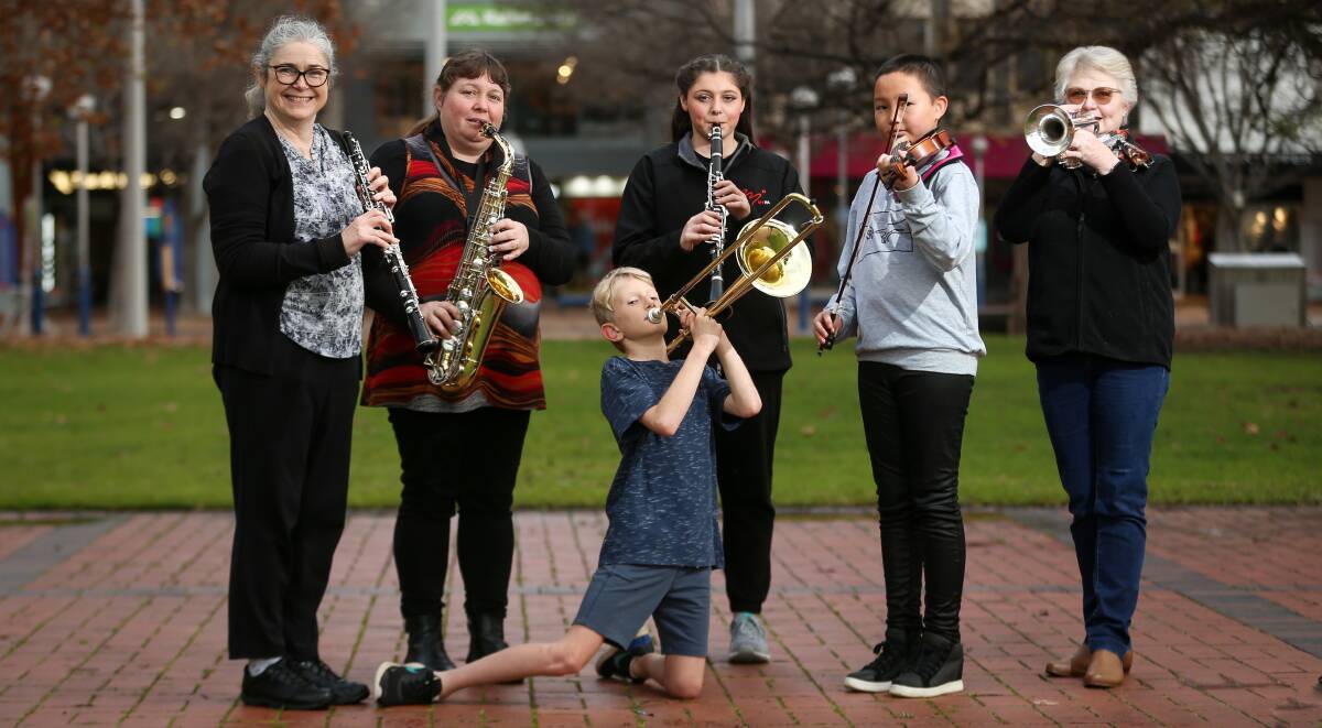THE BAND PLAYS ON: Participants Therese Scarfe, Mardi Sergi, Lucas Mordecai, 9, Samara Sergi, 17, Veda Zhang, 11, and Jennifer McMillan look ahead to the 2021 Border Spring Music Days, which follow last year's virtual music camp. Picture: JAMES WILTSHIRE